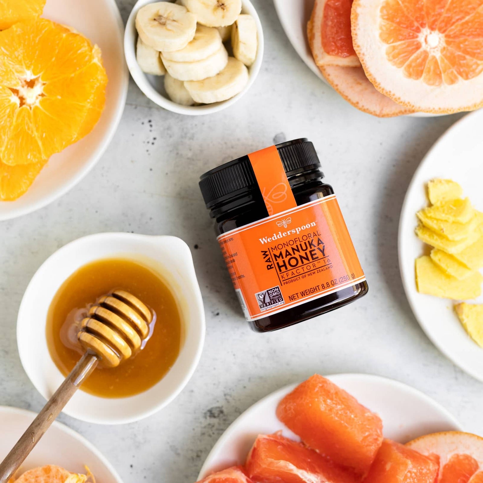 Wedderspoon Raw Manuka Honey 250g jar with orange label and black lid from New Zealand