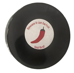 PowerHealth chilli hot balm for muscle aches in a black round container with warning label