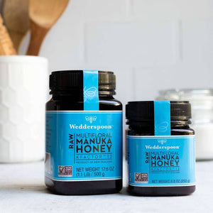 Wedderspoon Raw Manuka honey KFactor 12 jars in different sizes on kitchen countertop