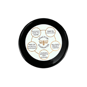 Wedderspoon Raw Manuka Honey 400 MGO 500g lid showing KFaktor guarantee with purity and sourcing details