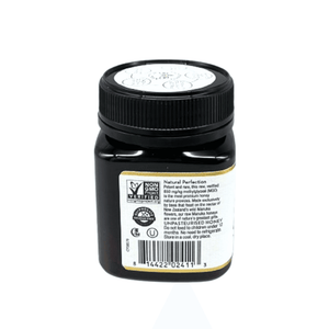 Wedderspoon Raw Manuka Honey 850 MGO 250g dark square jar with black lid and product label showing barcode