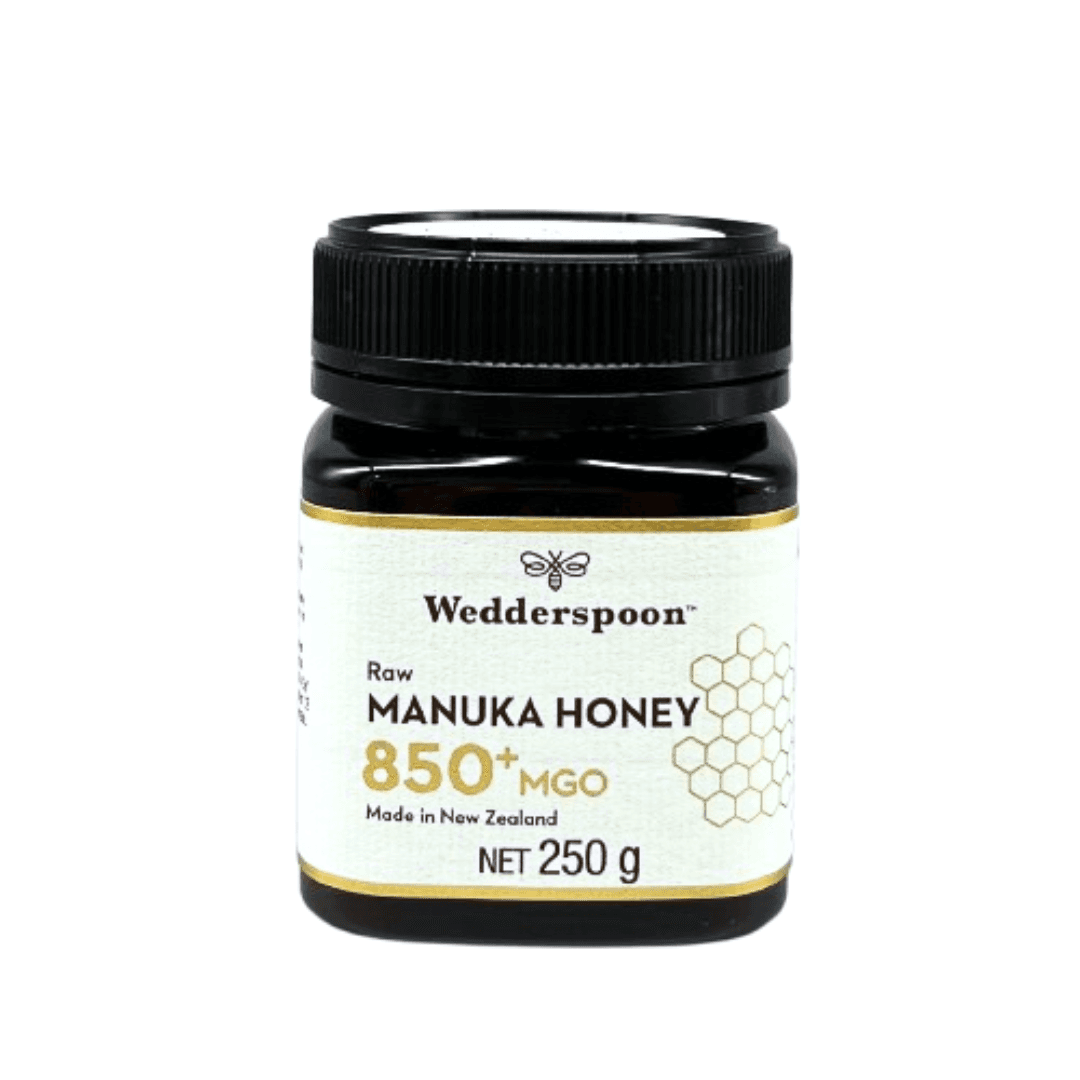 Jar of Wedderspoon Raw Manuka Honey 850 MGO 250g in dark jar with black lid and white label