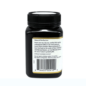 Wedderspoon Raw Manuka honey 850 MGO 500g dark brown jar with black lid showing back label and barcode