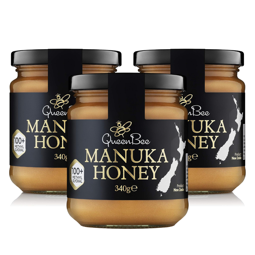 Jars of Queen Bee Manuka Honey on a white background