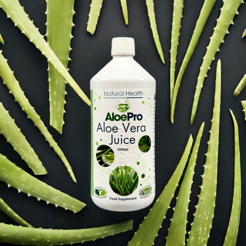 Manuka Honey Direct AloePro Aloe Vera Juice 1000ml bottle surrounded by fresh aloe vera leaves
