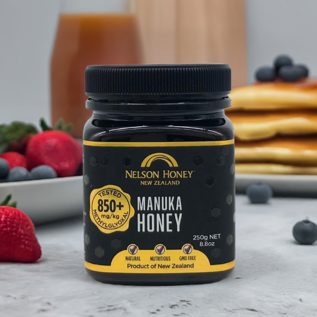 Nelson Manuka honey MGO 850+ jar on breakfast table with pancakes strawberries and blueberries