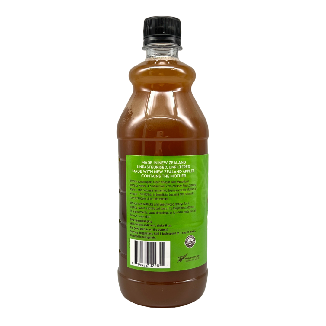 Wedderspoon apple cider vinegar with manuka honey in a clear plastic bottle with green label and black cap