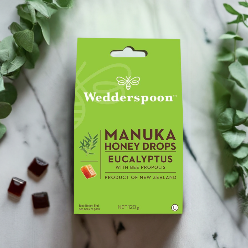 Wedderspoon manuka honey eucalyptus drops throat lozenges in green packaging with eucalyptus leaves