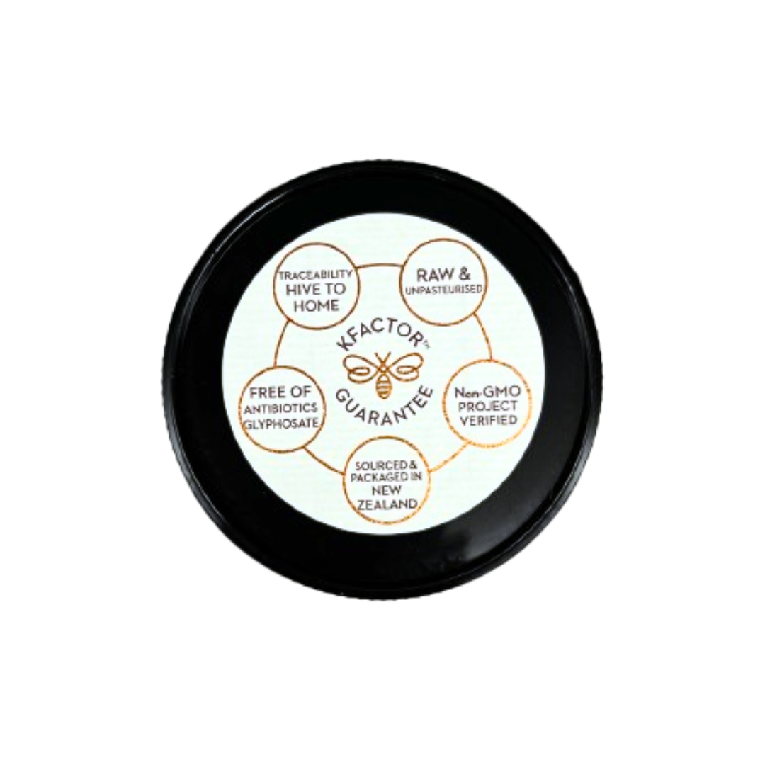 Wedderspoon Raw Manuka Honey 400 MGO 500g lid showing KFaktor guarantee with purity and sourcing details