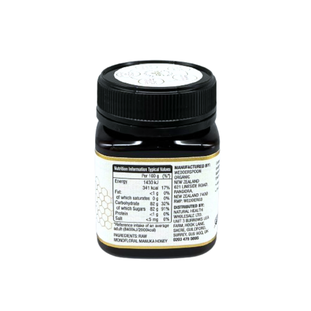 Wedderspoon Raw Manuka Honey 850 MGO 250g . Small dark jar with black screw lid showing nutrition label on rear