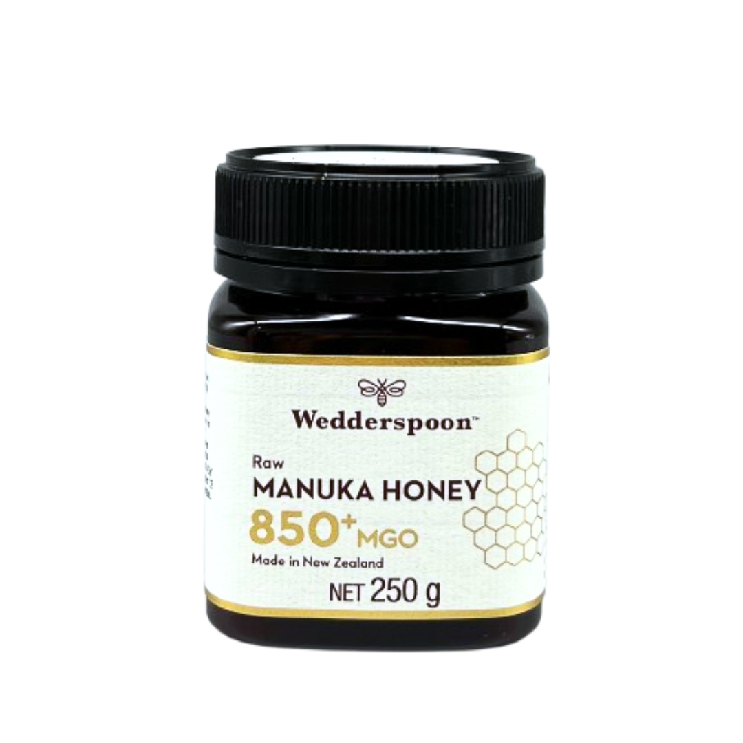 Jar of Wedderspoon Raw Manuka Honey 850 MGO 250g in dark jar with black lid and white label