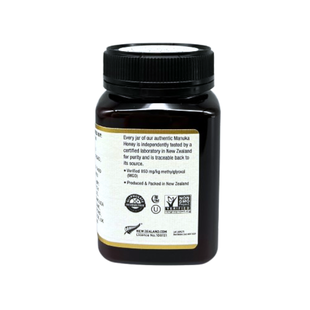 Wedderspoon Raw Manuka honey 850 MGO 500g dark plastic jar showing back label and black screw lid