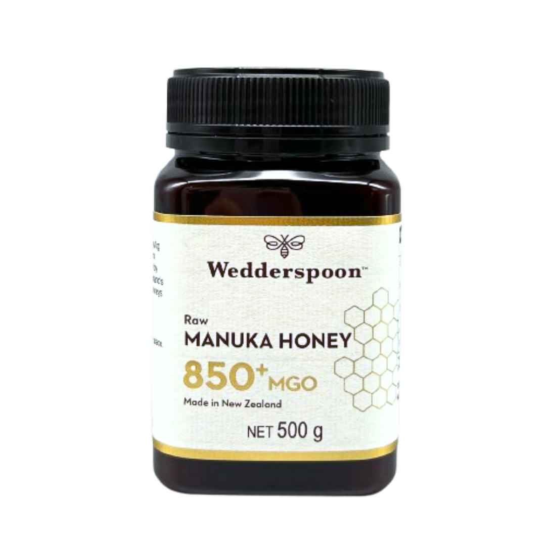 Wedderspoon Raw Manuka honey 850 MGO 500g jar in dark plastic with black lid and white honeycomb label