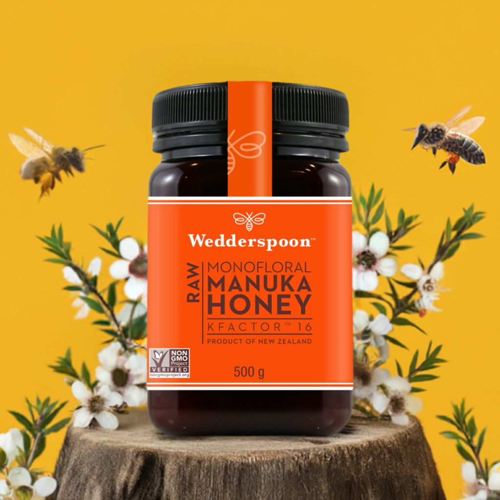 Wedderspoon Raw Manuka Honey KFactor 16 Six Pack jar with orange label and bees on yellow background
