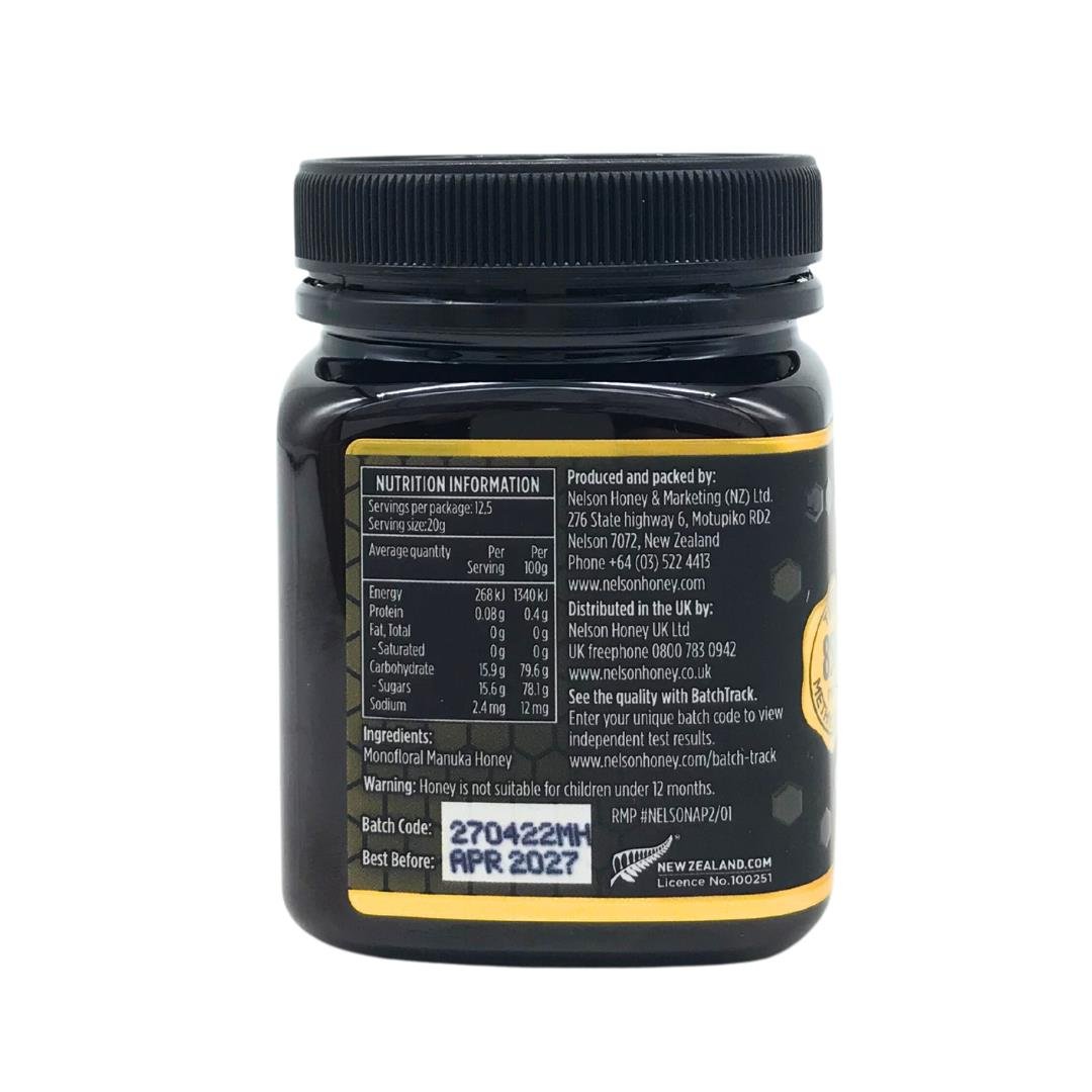 Back of black jar of Nelsons Manuka honey showing nutrition label batch code and Nelson Manuka honey MGO 850+