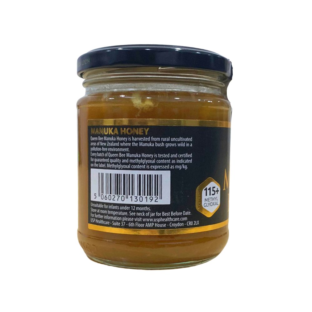 Queen Bee Manuka Honey 340g Glass Jar with dark blue lid and golden honey inside