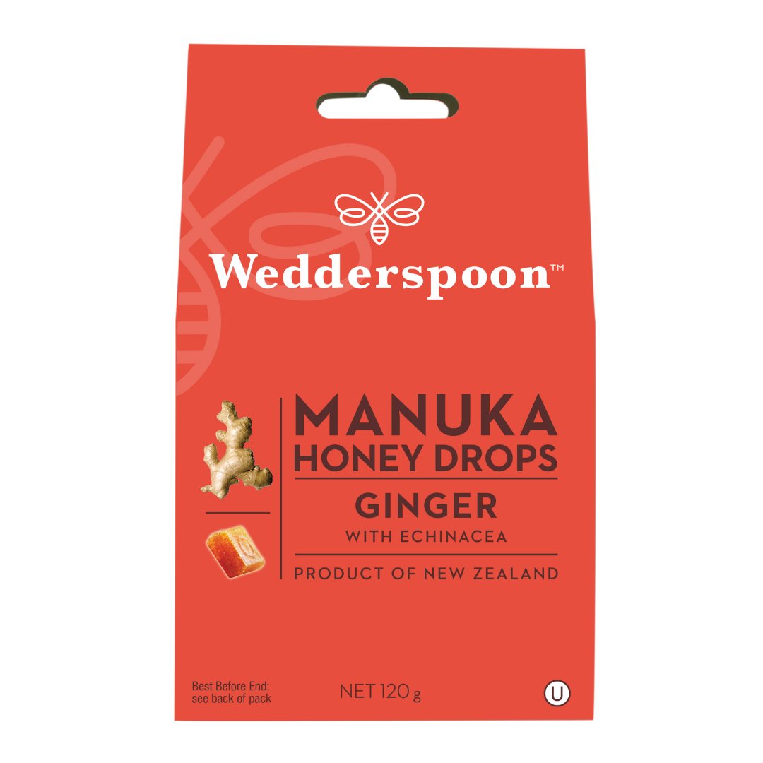 Wedderspoon manuka honey ginger drops throat lozenges in red packaging with ginger and honey images